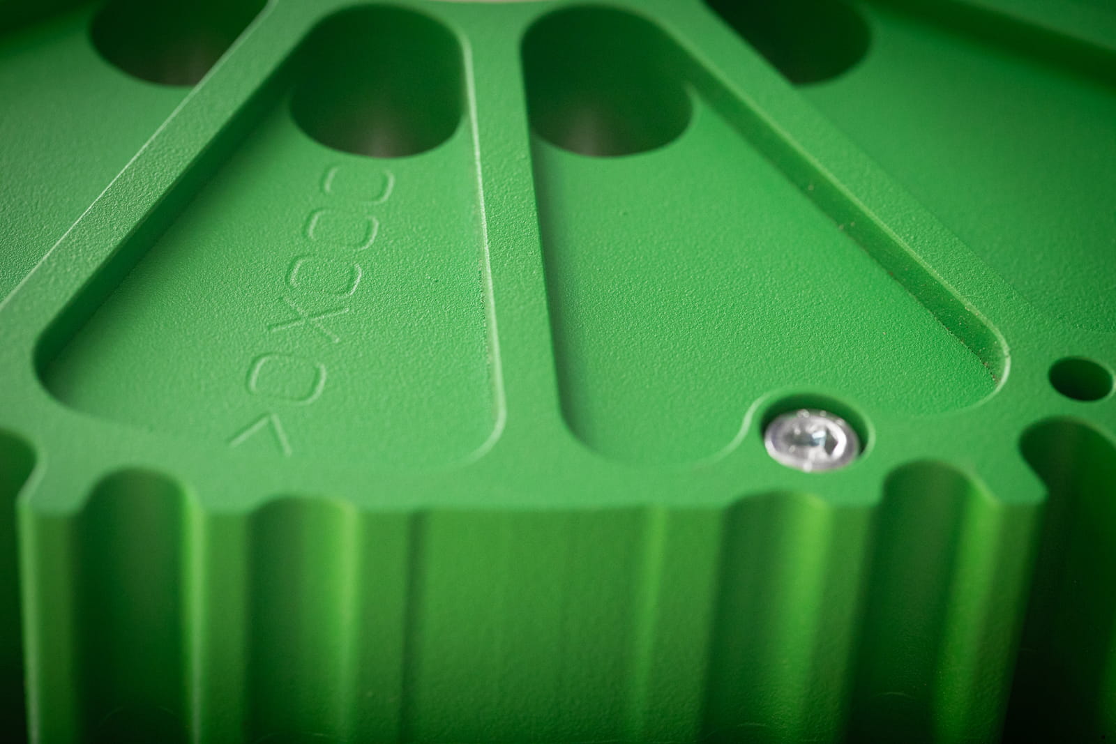 Eine Detailaufnahme des grasgrünen XOOO AMX Axialflussmotor.